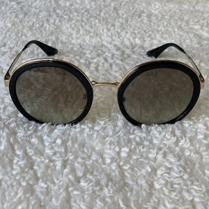 Prada round sunglasses black and gold color